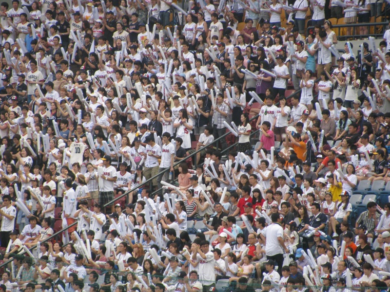 tadium waving white fans